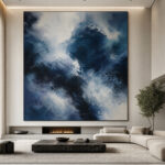 A luxury minimalist living room featuring a massive abstract painting that dominates the visual field, creating a sense of immersion.