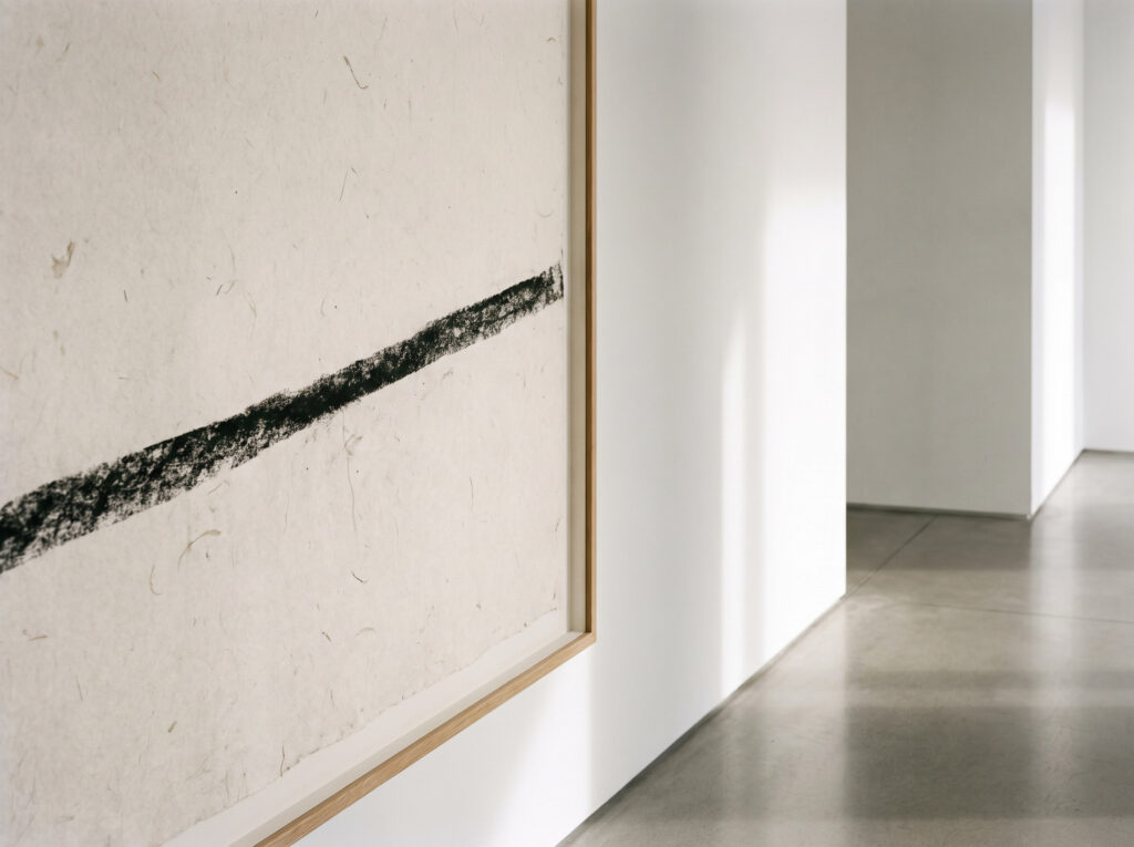 Minimalist Art and Slow Living: A single bold line abstract painting serving as a visual anchor.]