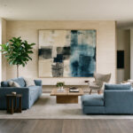 Minimalist Color Psychology featured image: A sophisticated living room with soft beiges, warm greys, and muted blues.