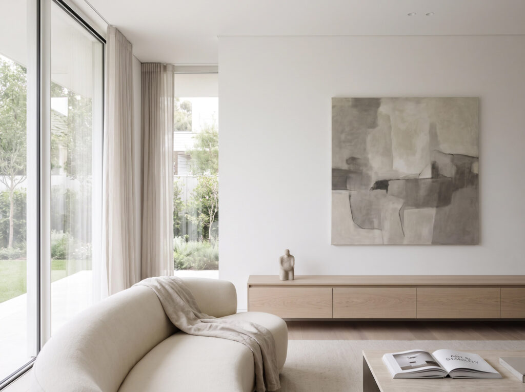 Serene living room in a luxury villa with a calm monochromatic minimalist painting as a visual anchor.