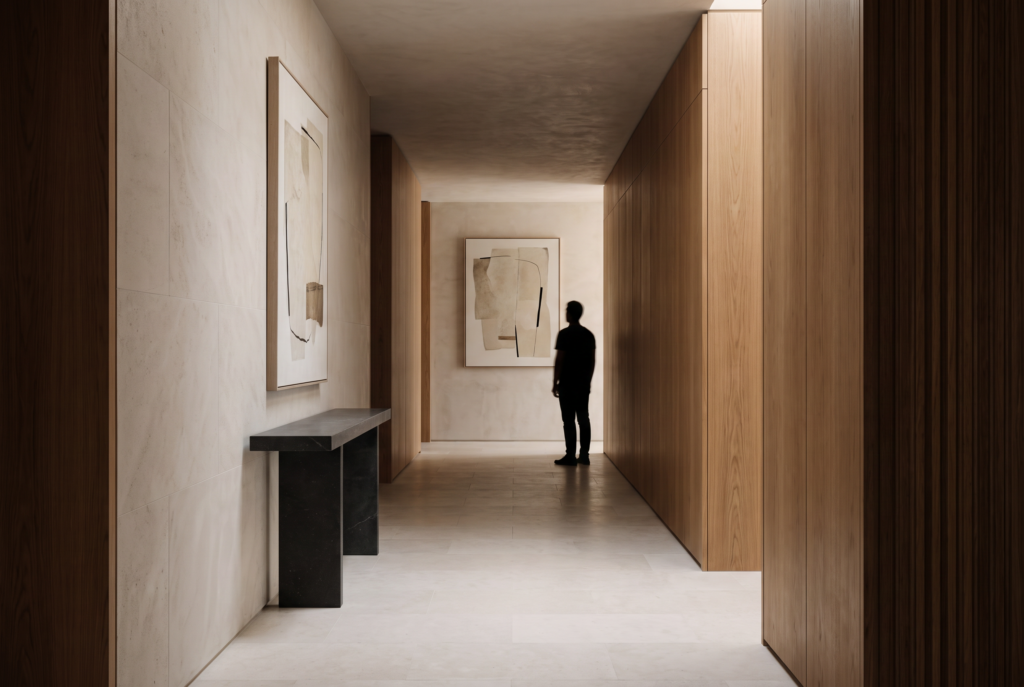 A minimalist artwork positioned at a natural viewing height along a refined architectural entry corridor.